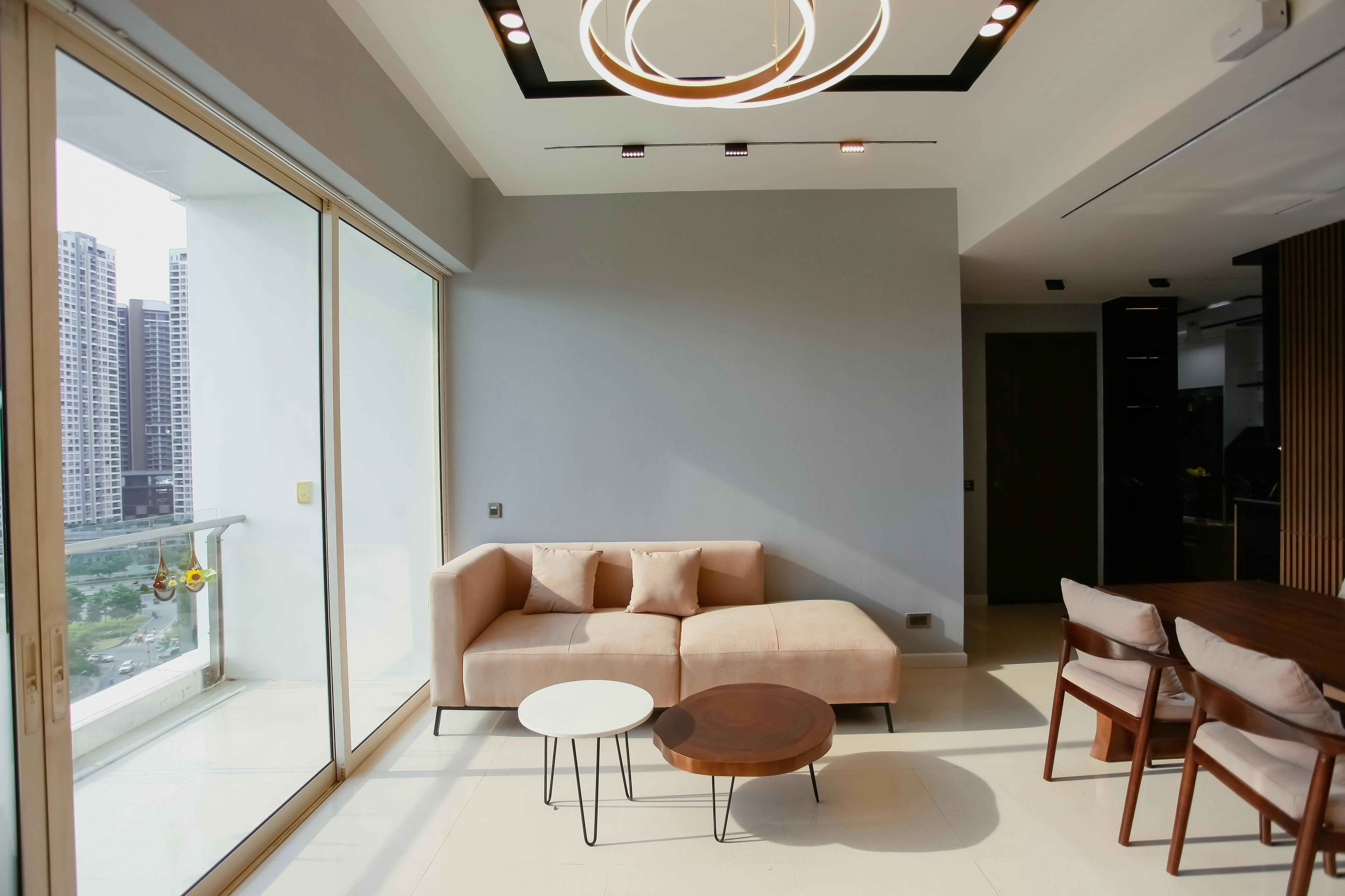 bright sunlit apartment interior with large windows overlooking a busy city street - city view apartment homes