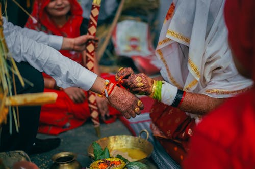 Closeup of Women with Mehendi on Hands, During a Ritual