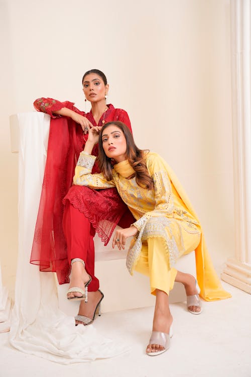 Young Women Posing in Elegant Traditional Clothing 