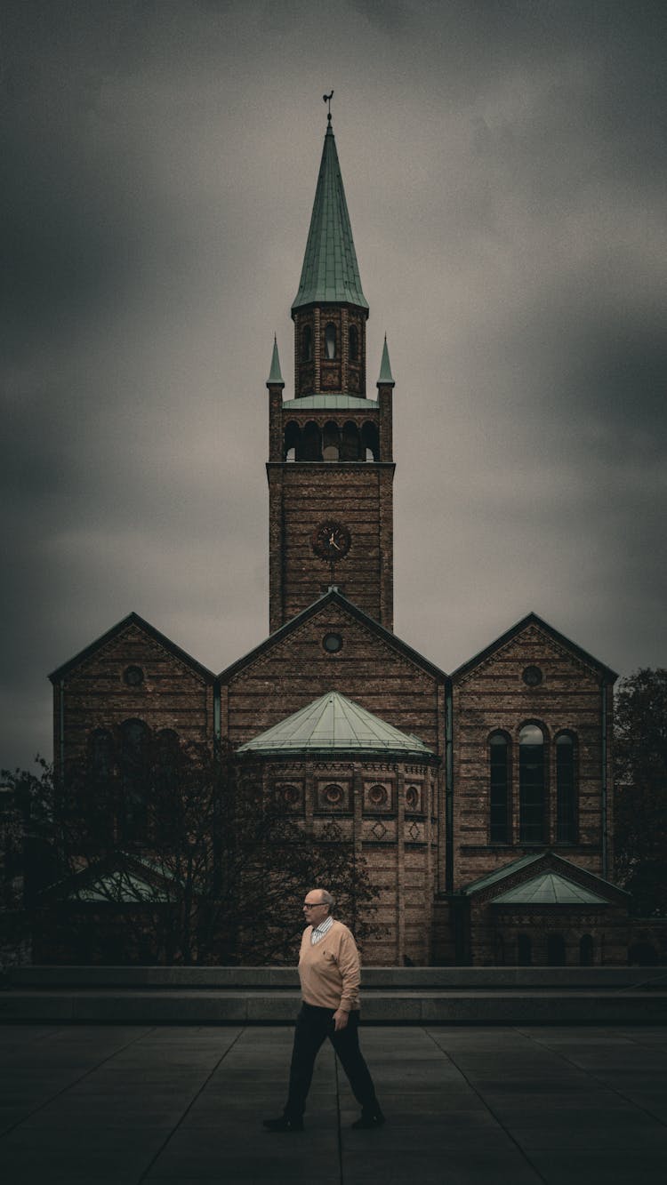 Passerby Behind St Matthew Church In Berlin