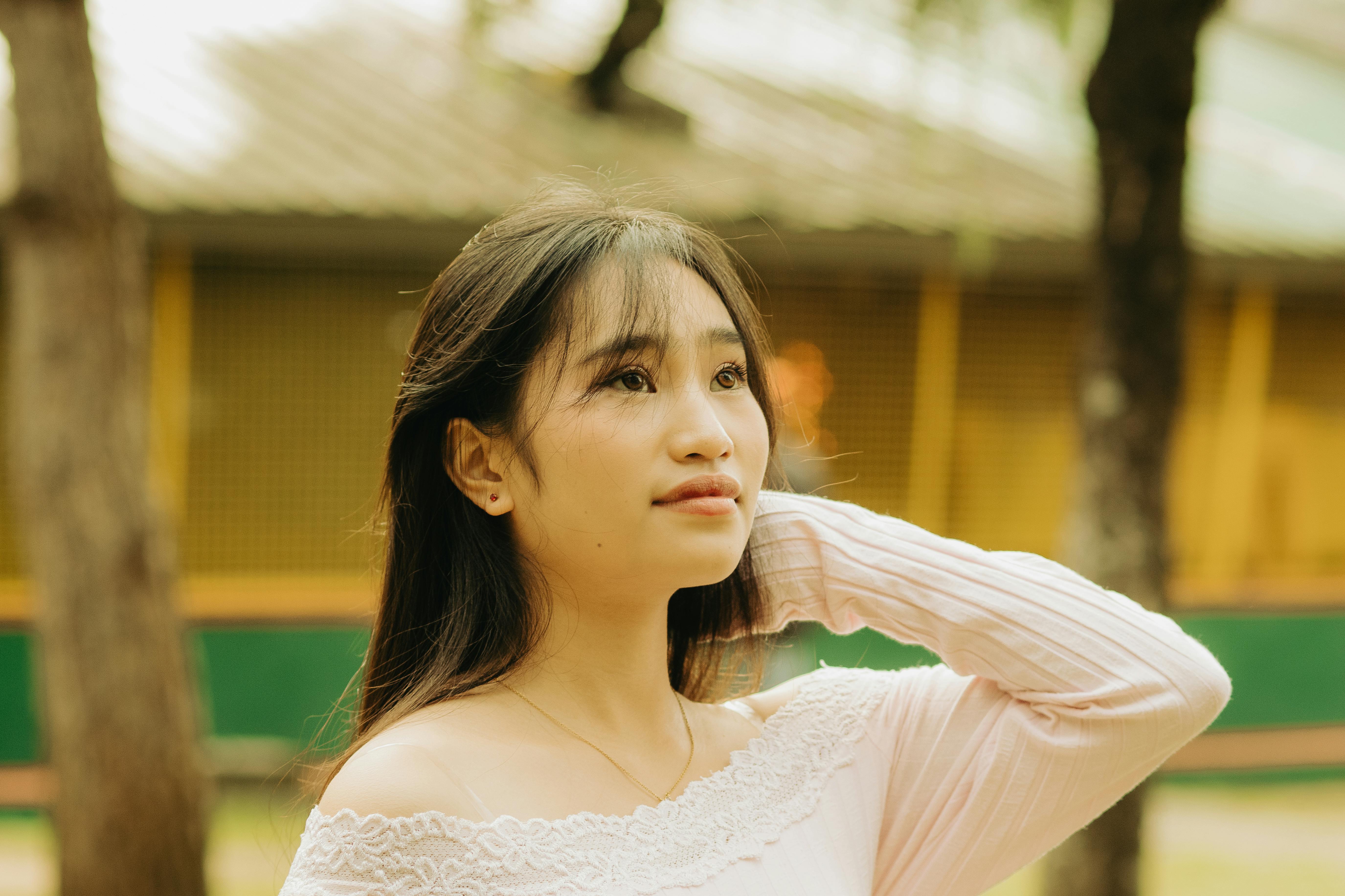 Hopeful young adult stepping into sunlight, looking forward with optimism - counseling for young adults