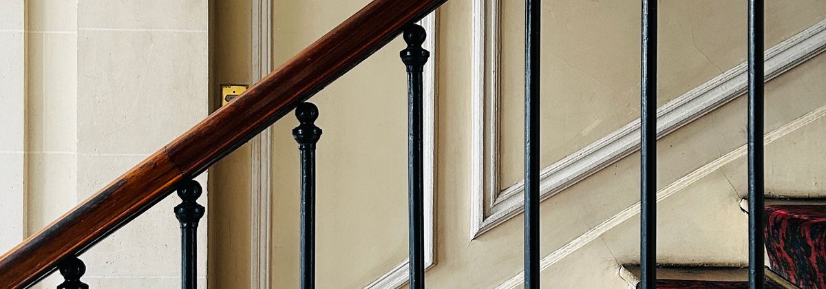 A home staircase with a railing