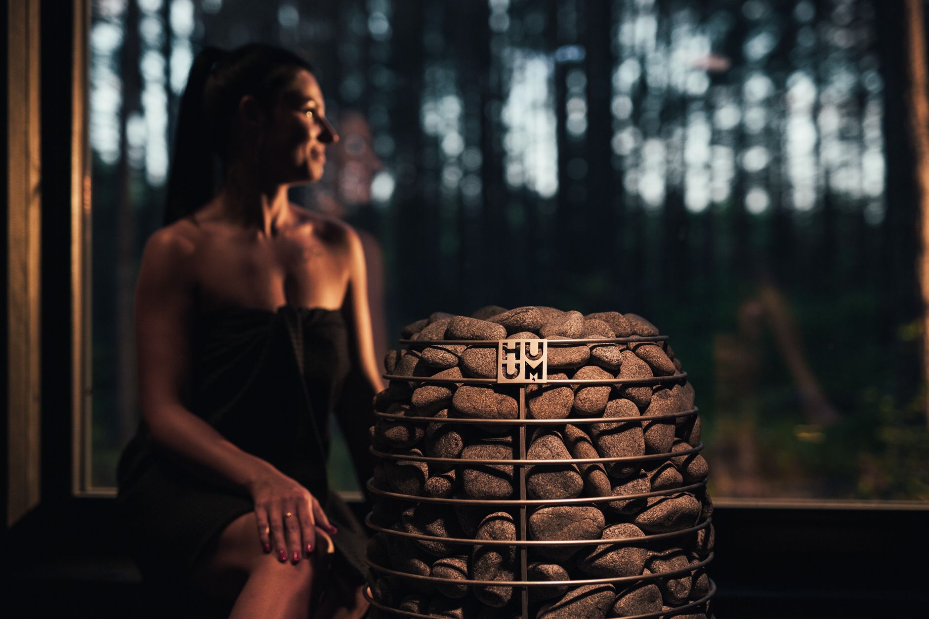 Woman meditating peacefully inside a warm, inviting sauna.