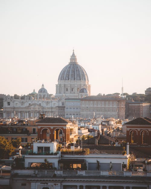 Free St Peters Basilica Dome over Buildings in Vatican and Rome Stock Photo