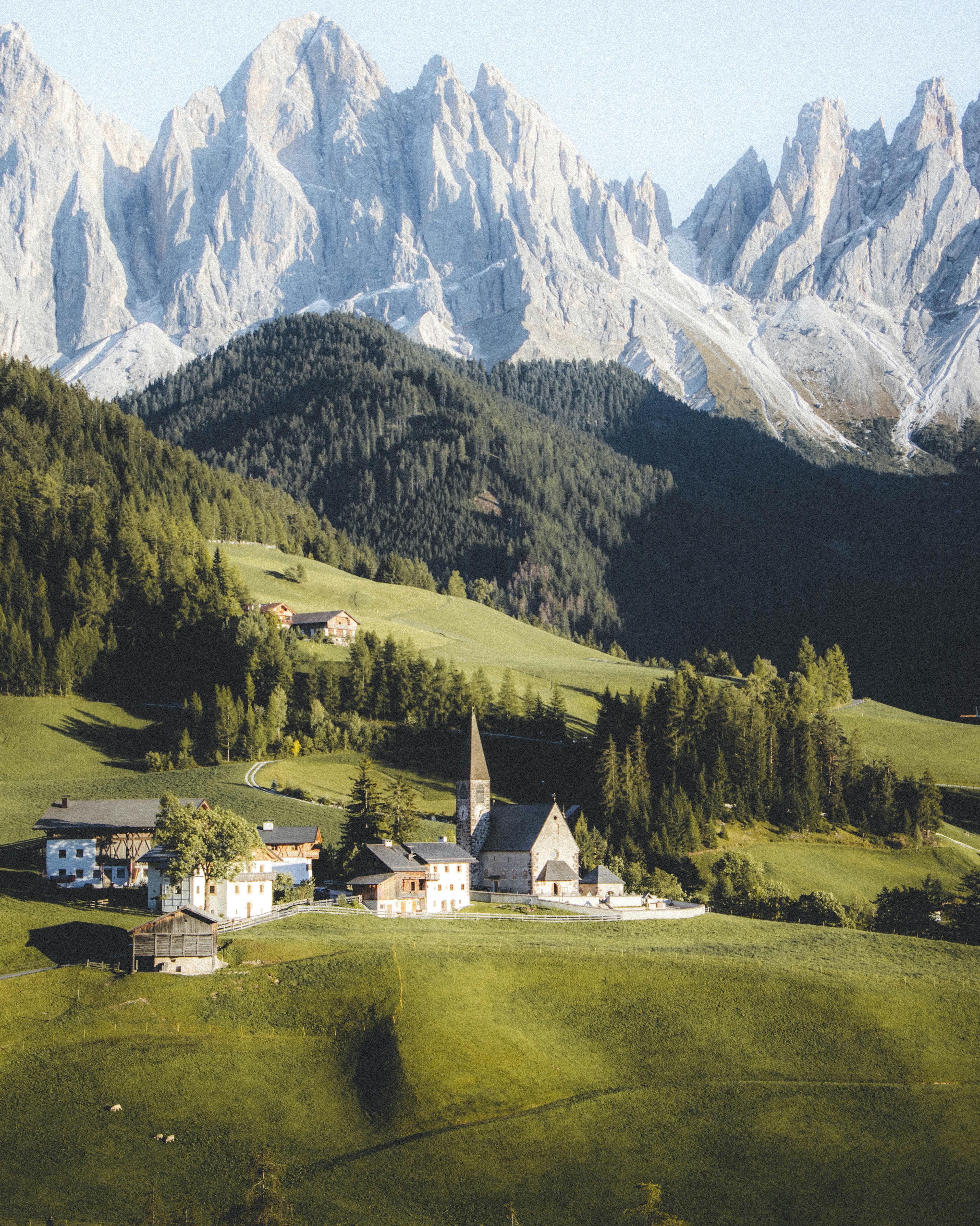 Charming St Magdalena village against the dramatic backdrop of the Dolomites in Italy.