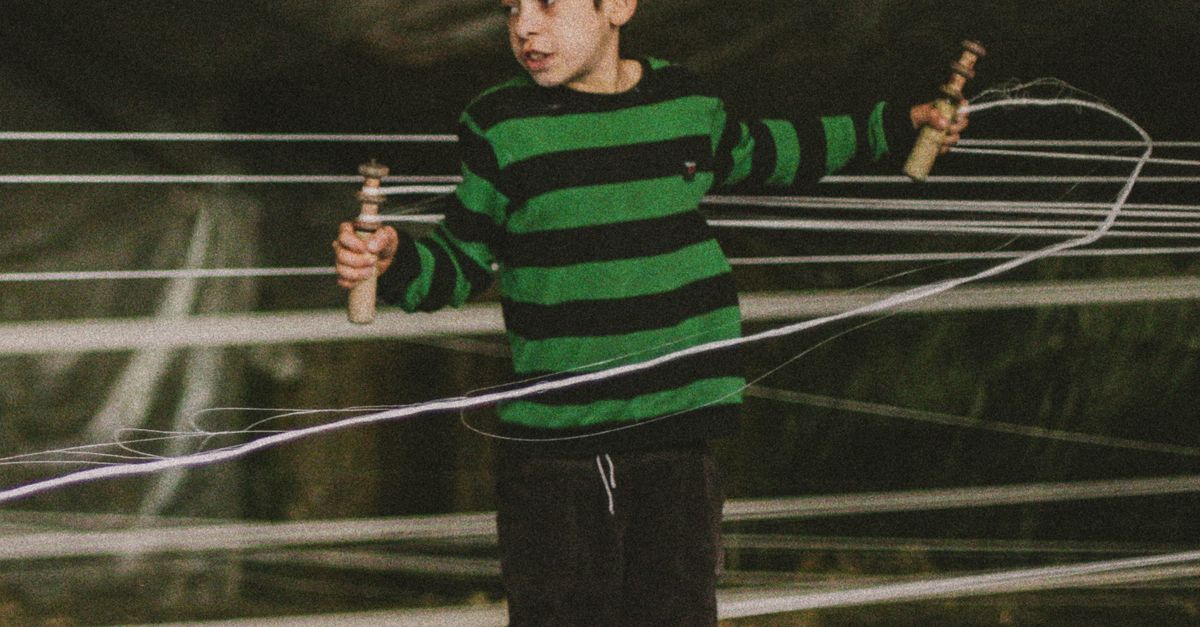 Thread For Boy A Boy Preparing the Threads for Weaving · Free Stock Photo