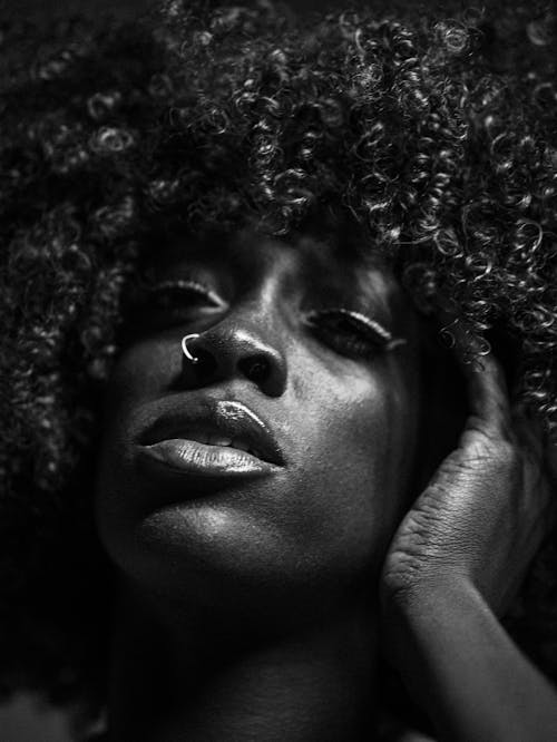 Beautiful Black Woman with curly hair close up shot