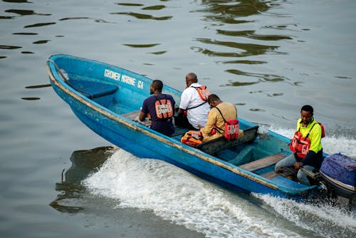 Men Sitting on Motorboat