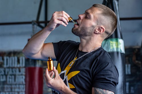 Man Taking Hemp Oil