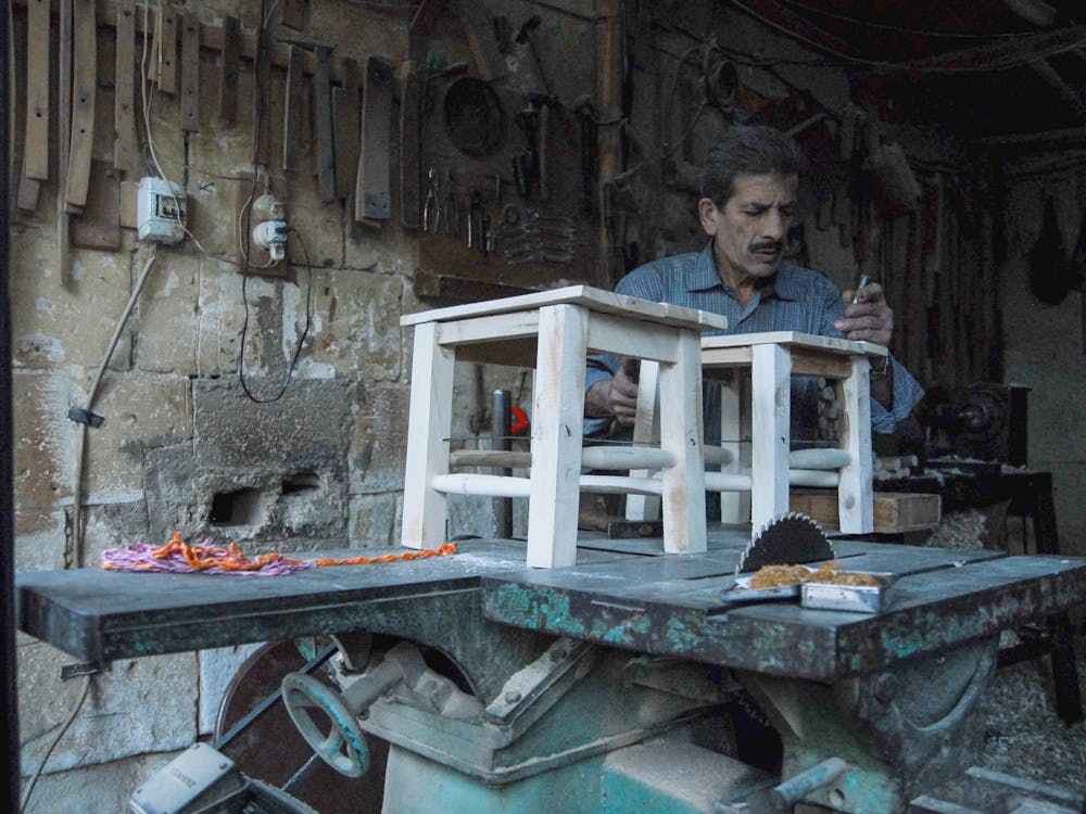 Carpenter at Workshop Making Stools