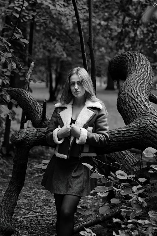 Model in Jacket and Mini Posing by Tree
