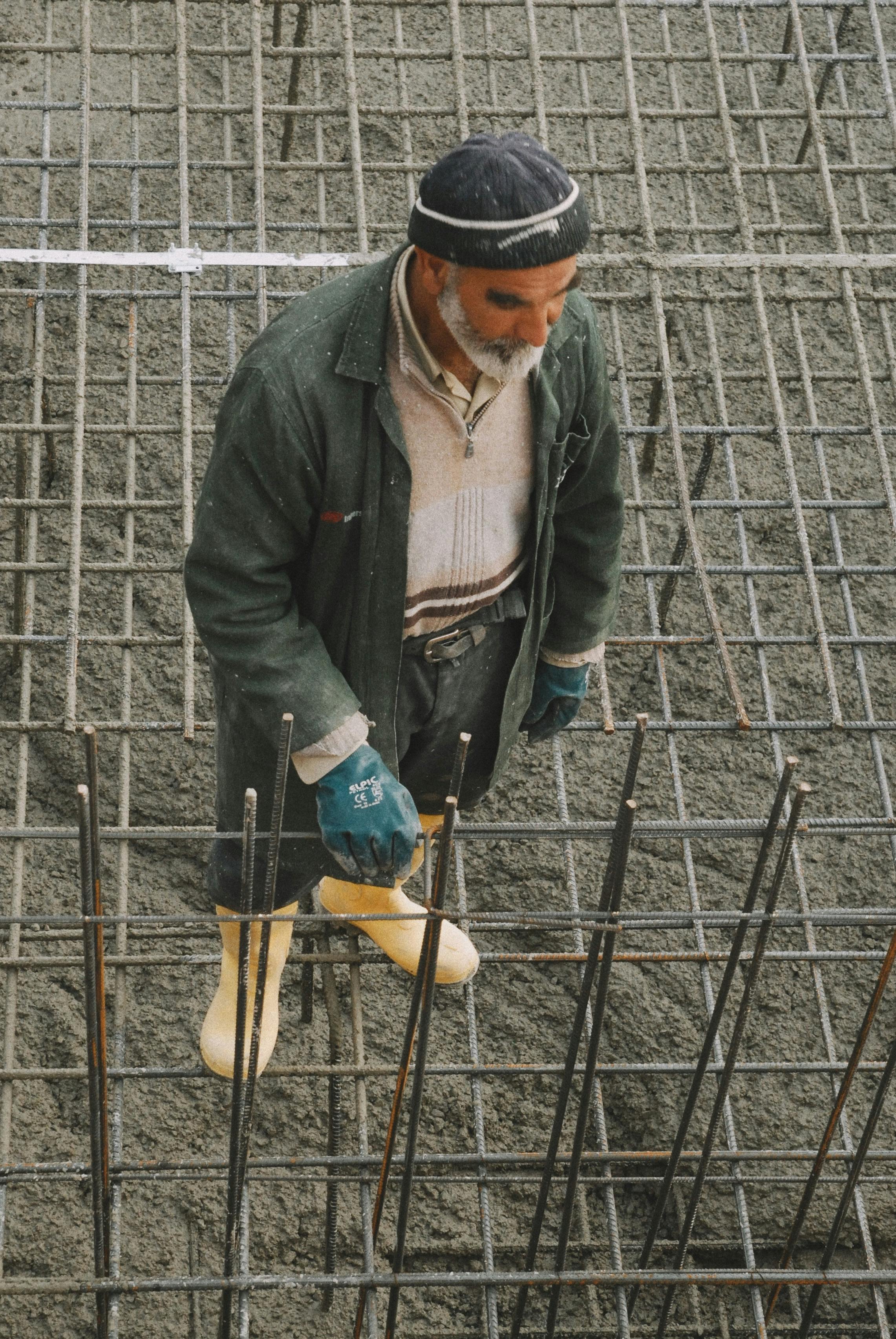Contractor inspecting rebar before concrete pour