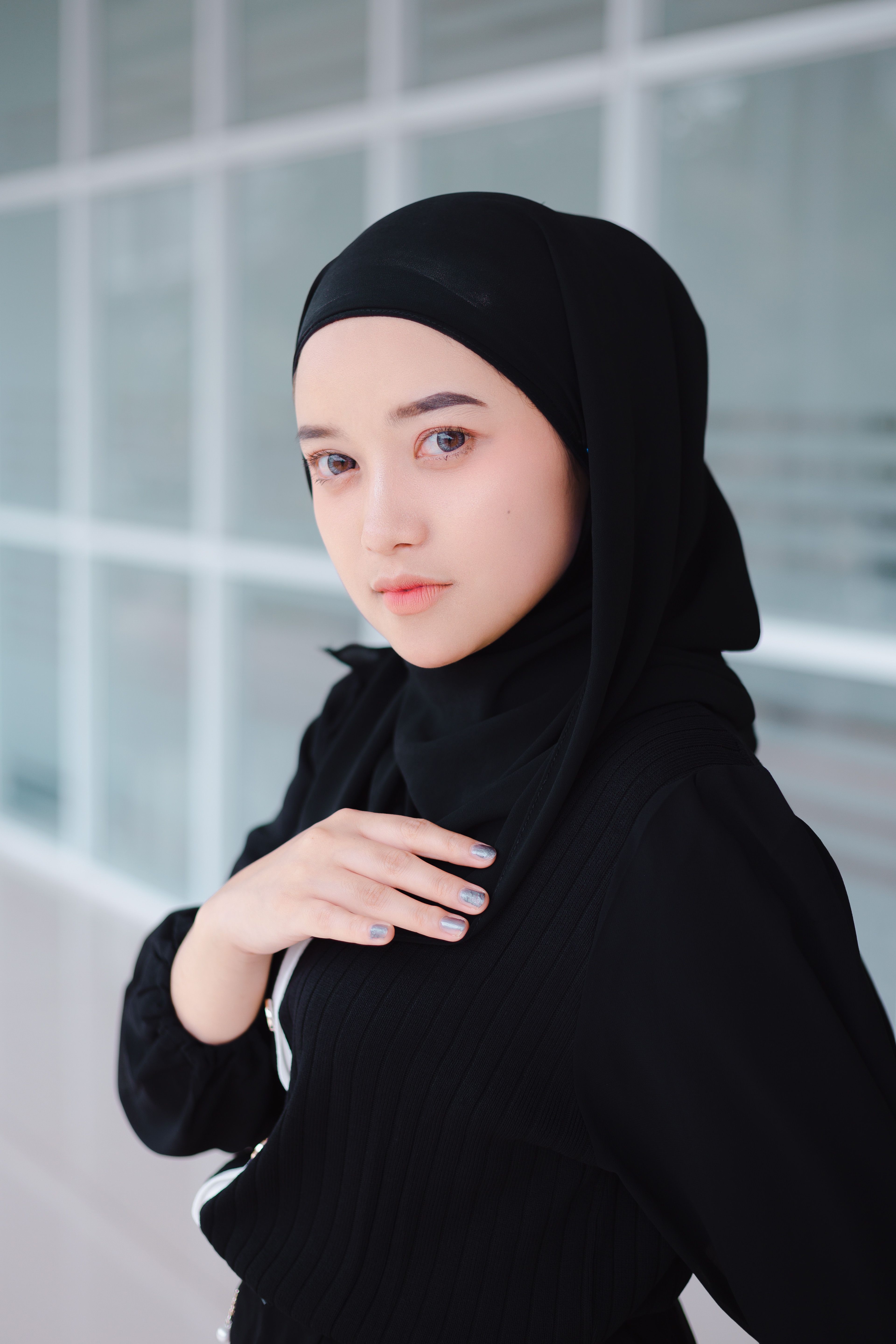 Portrait of a Young Woman in a Black Hijab Headscarf · Free Stock Photo