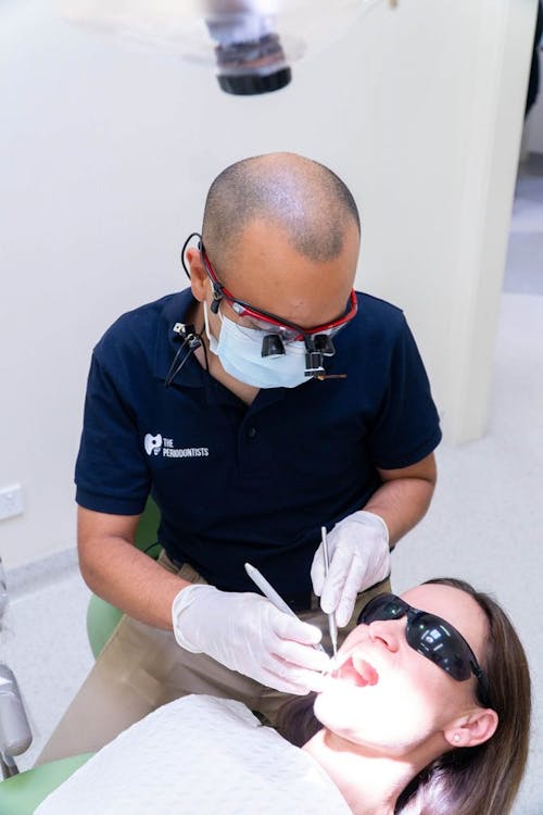 Dentist Treating Woman Teeth