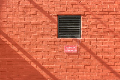 Sun Shining on a Bright Brick Wall 