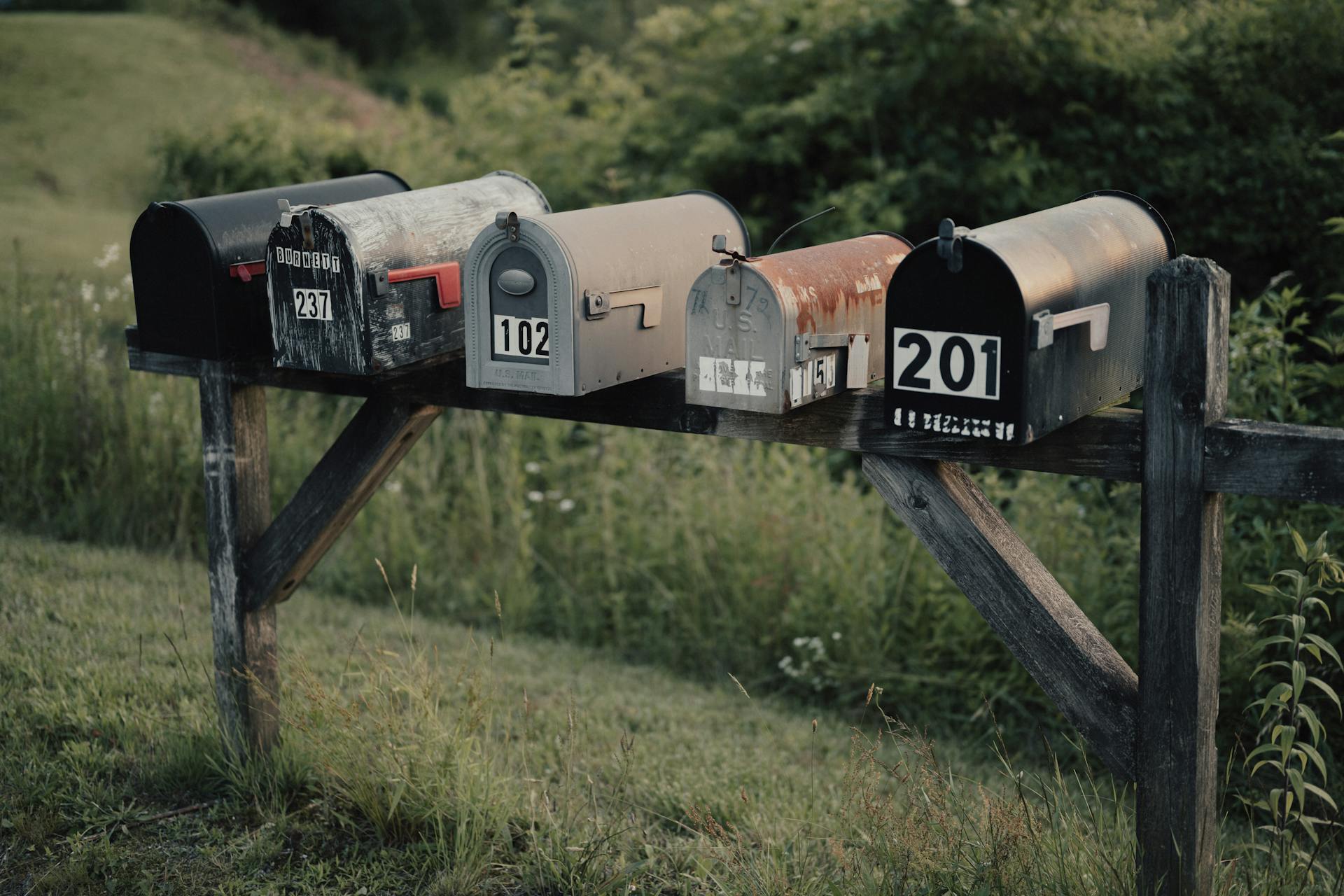 Old Mailboxes on a Wooden Construction