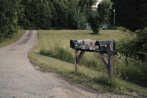 Mailboxes on a Wooden Construction by the Road in the Countryside 