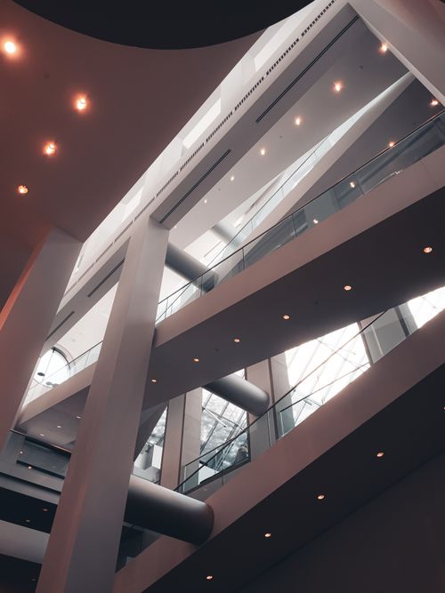 Free Interior view of a contemporary atrium with sleek design and natural lighting. Stock Photo