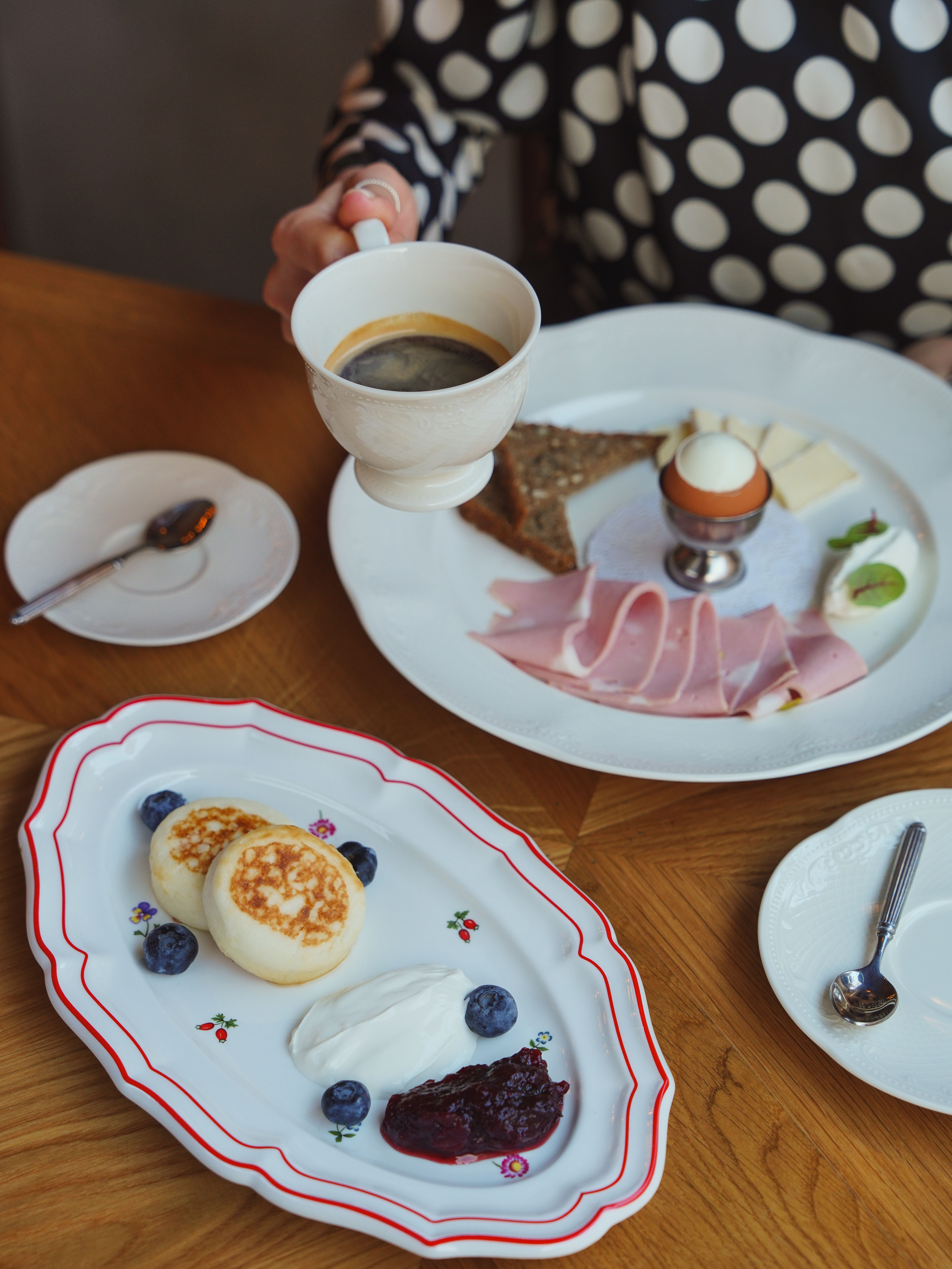 Delightful breakfast scene with ham, boiled egg, and coffee for a perfect morning start.