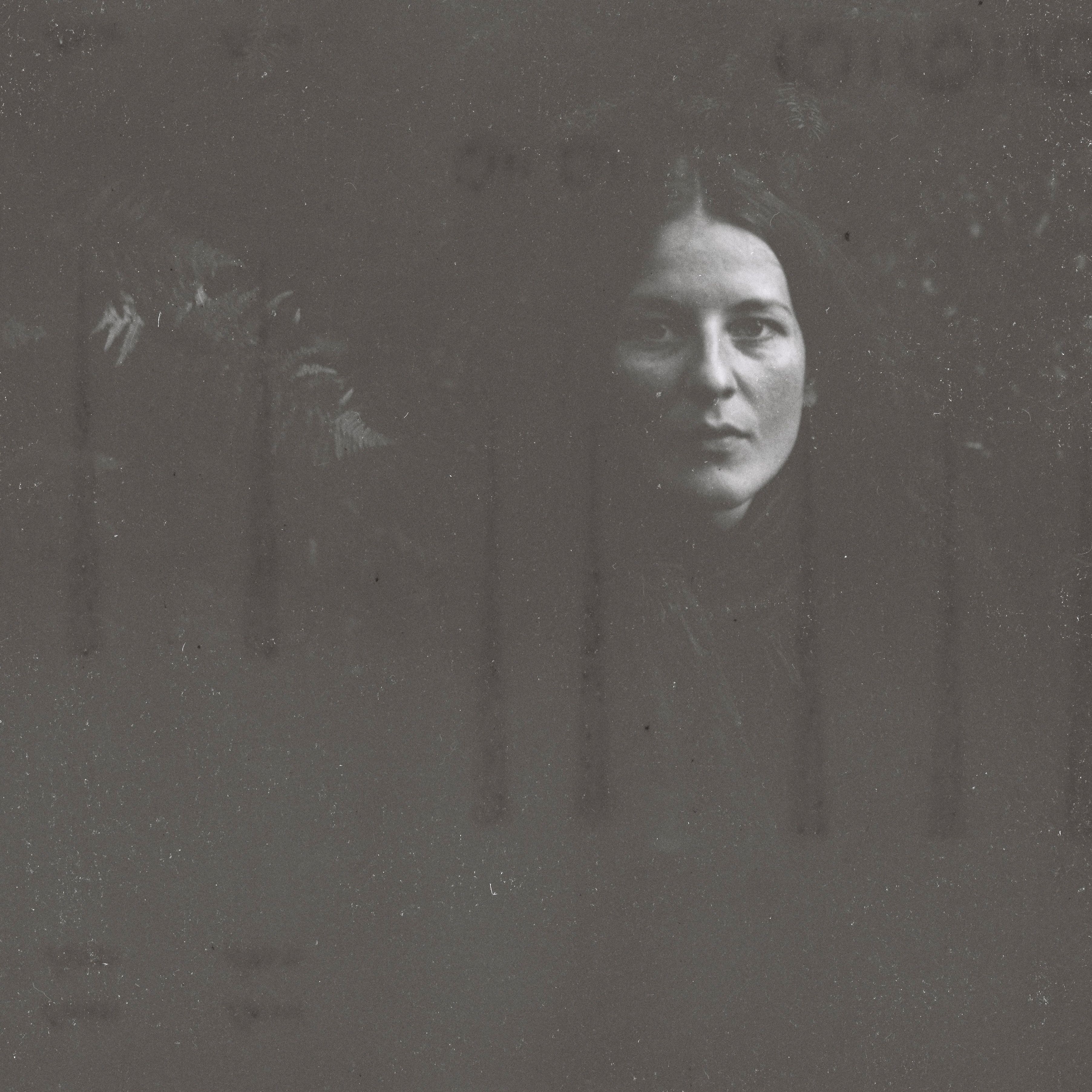 Brunette Woman in Grainy Photo