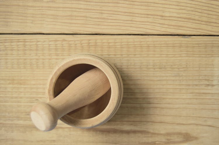 Brown Wooden Pestle And Mortar