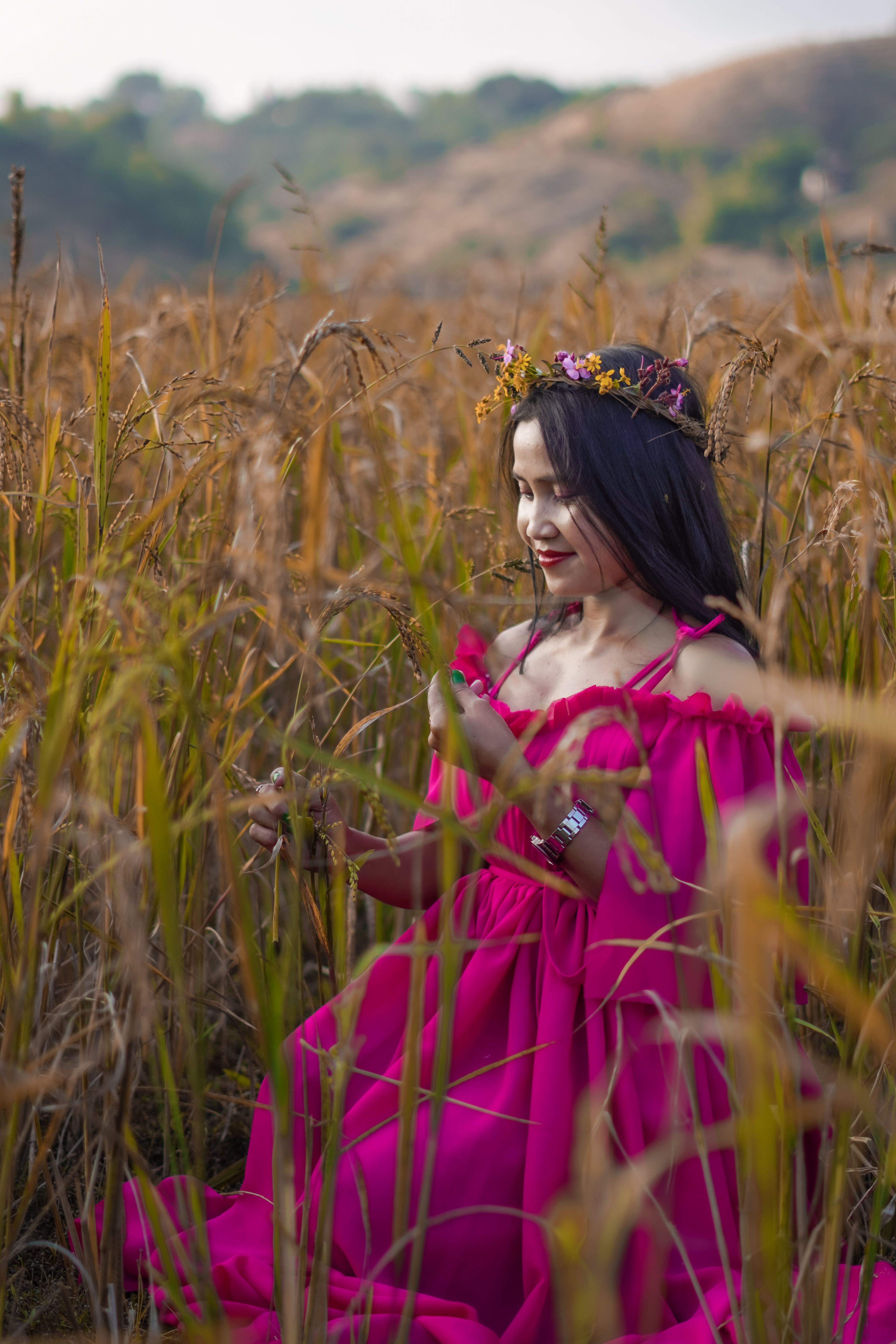 Young Woman in a Purple Dress Sitting on a Field · Free Stock Photo