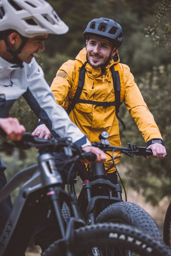 Two riders in safety helmets