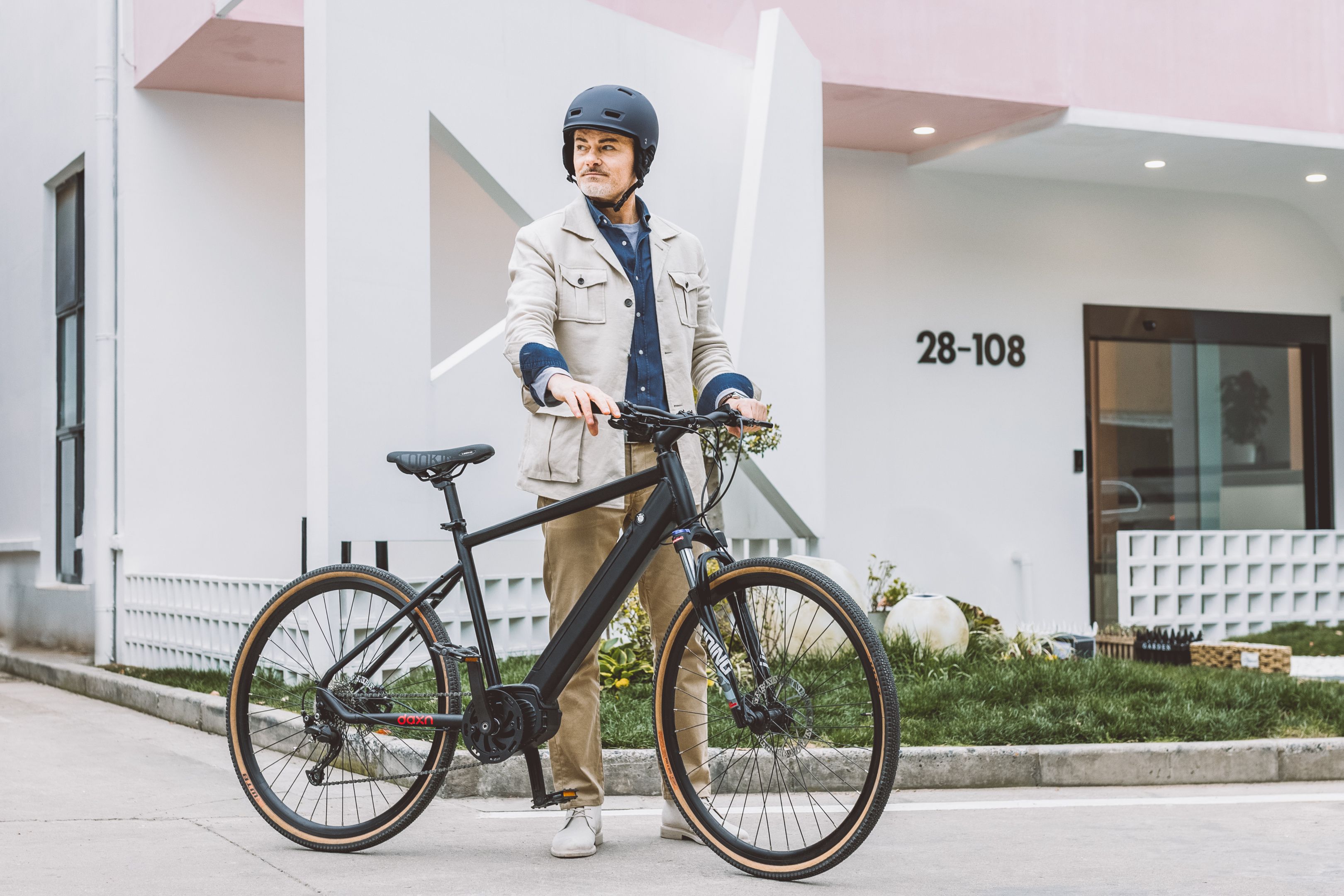 Portrait of a Man Standing Outdoors with an Electric Bicycle · Free ...