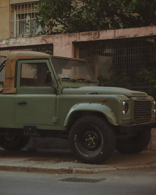 An Old Military Pick-up-Truck Parked on the Street