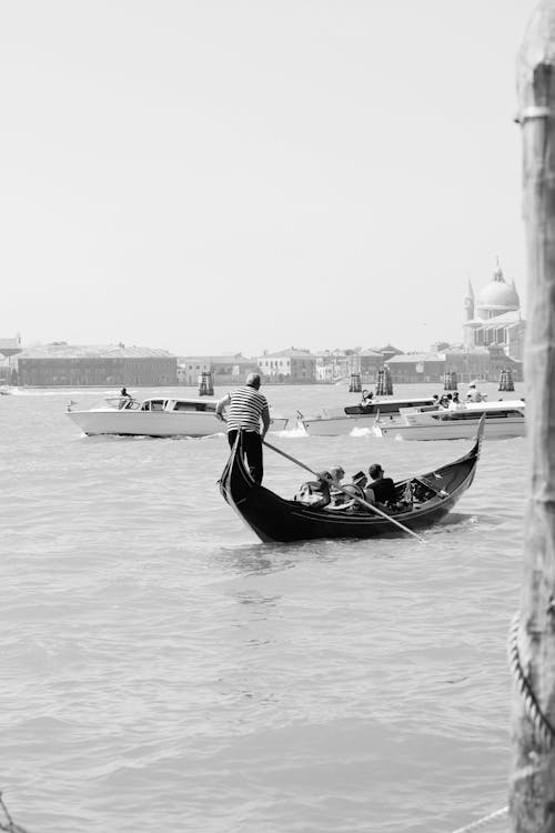 Venetian Canal with a Gondola Sailing in the Foreground