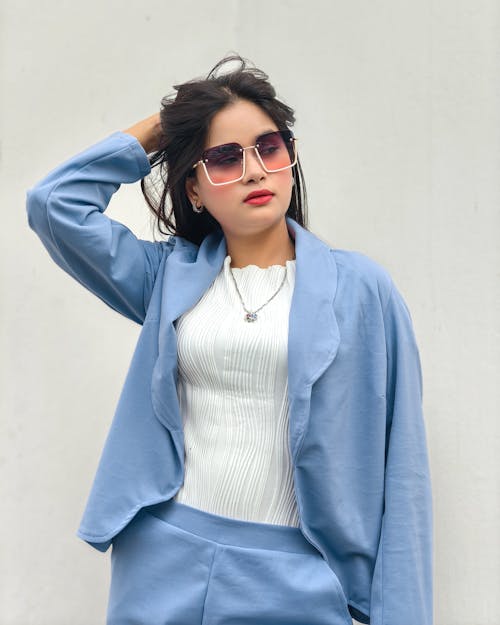 Portrait of Woman in Blue Jacket and Sunglasses 