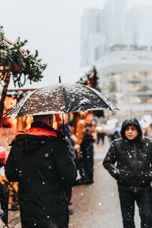 People on Snowy Christmas Fair