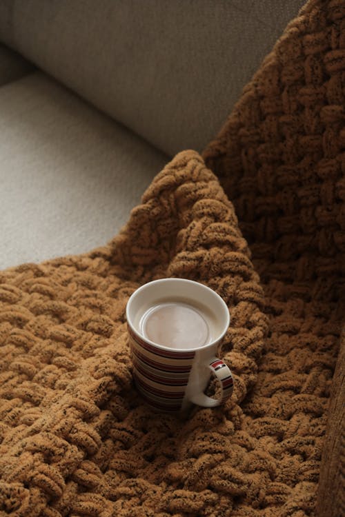 Coffee in Mug on Brown Blanket
