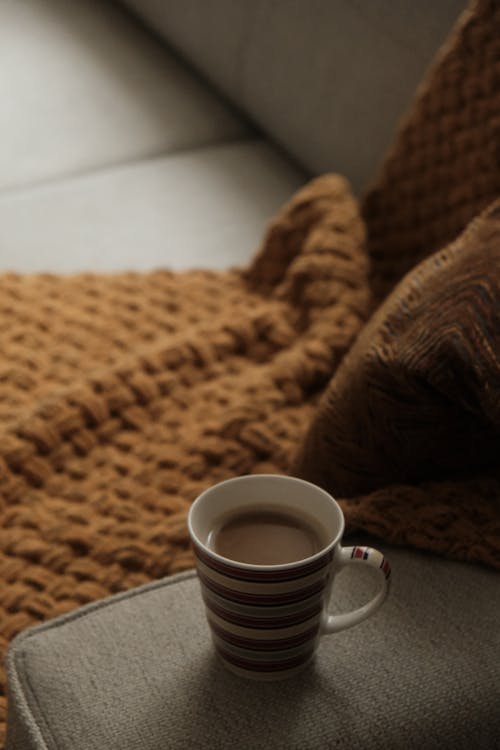 Free Coffee and Blanket on a Sofa  Stock Photo