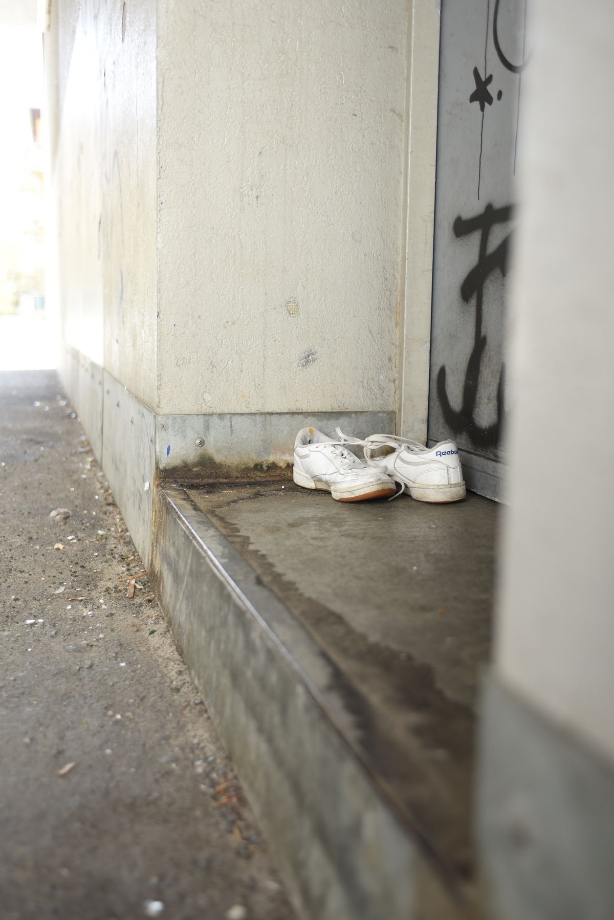 White sneakers on a doorstep showing shoe storage ideas for small spaces