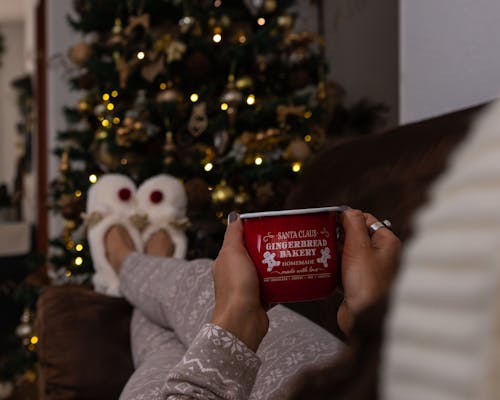 Woman on a Sofa with a Christmas Cup