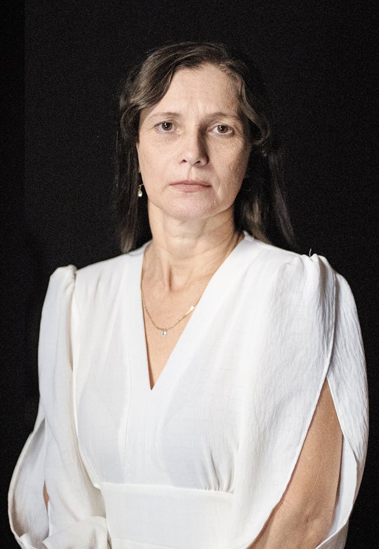 Portrait Of A Serious Woman Wearing A White Blouse