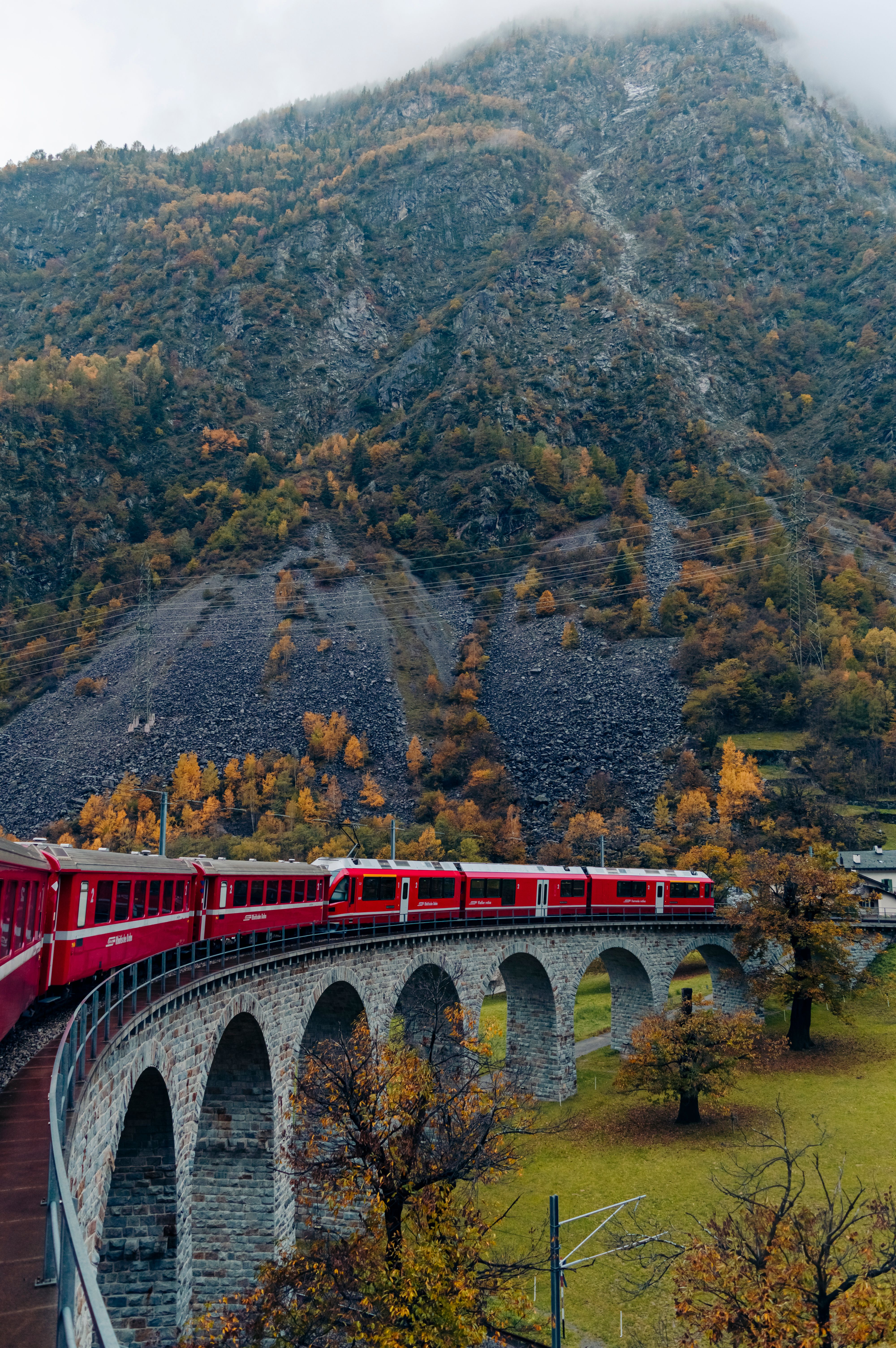 Red Train in a Mountain Valley · Free Stock Photo