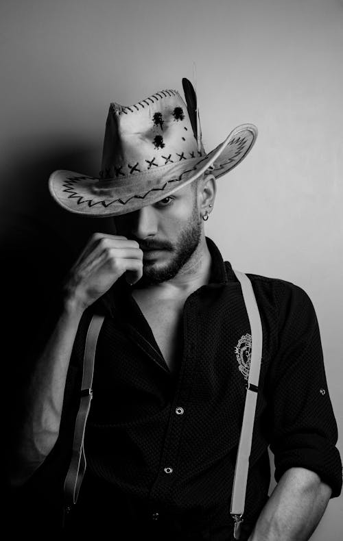 Black and White Portrait of a Young Man in a Hat 