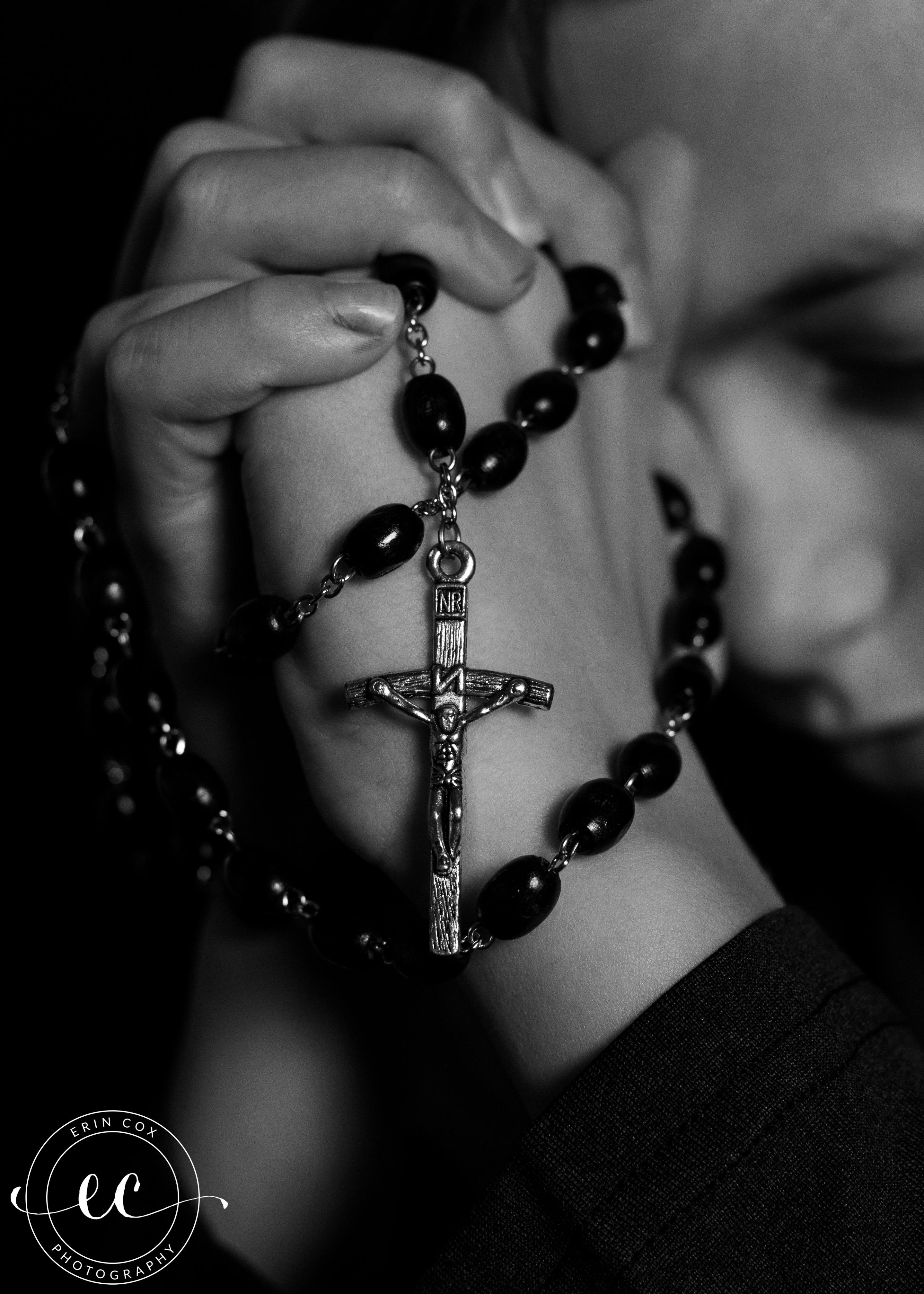 praying rosary hands