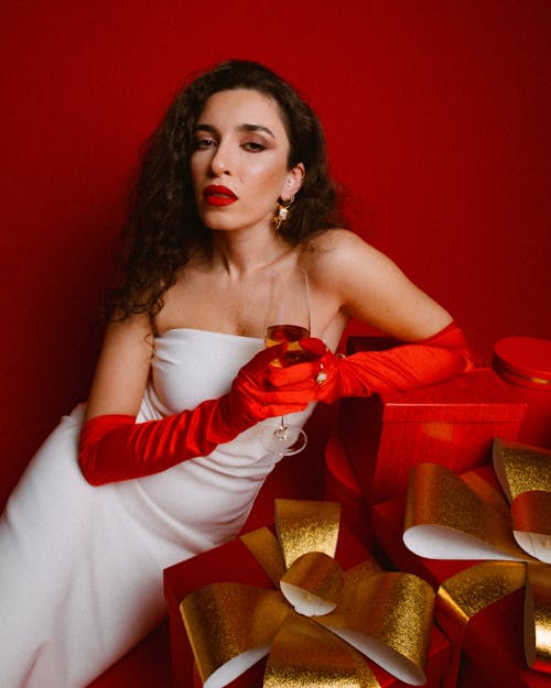 Portrait of Elegant Woman Among Christmas Gifts 