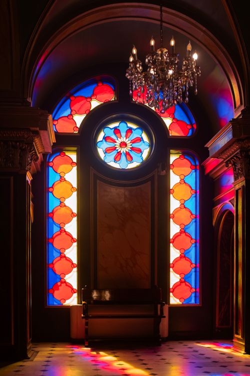 Free Vibrant stained glass window with chandelier in Istanbul church interior. Stock Photo
