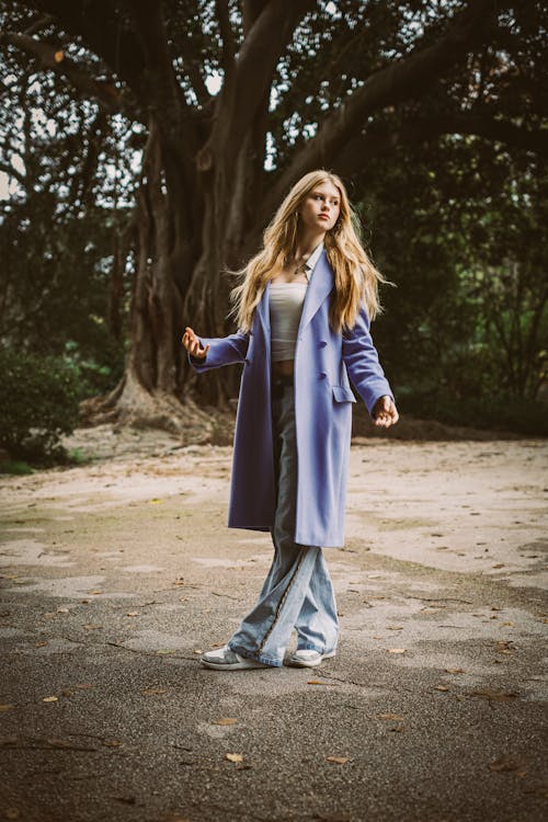 Young Woman in a Blue Wool Coat and Jeans 