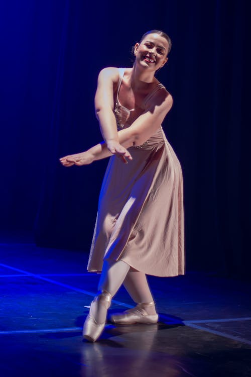 A Woman Dancing on Stage 