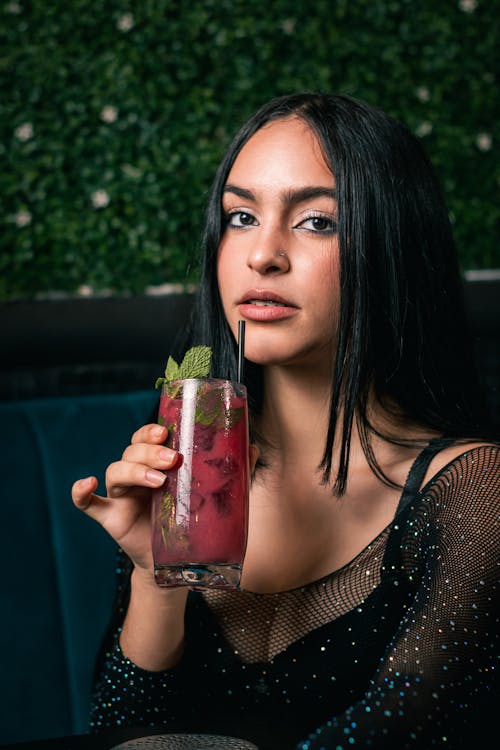 Woman Drinking Raspberry Cocktail