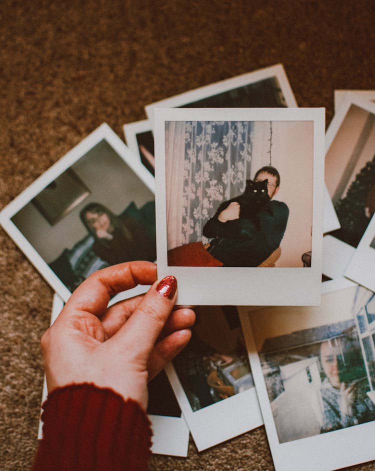 Photo Of Person Holding Polaroid