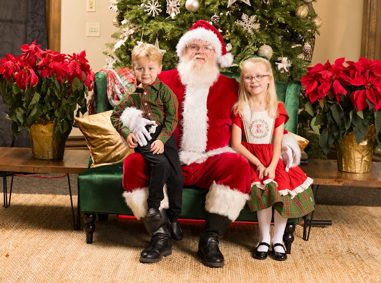 Santa Claus Posing With Boy And Girl