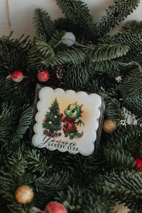 Little Green Dragon Decorating Christmas Tree