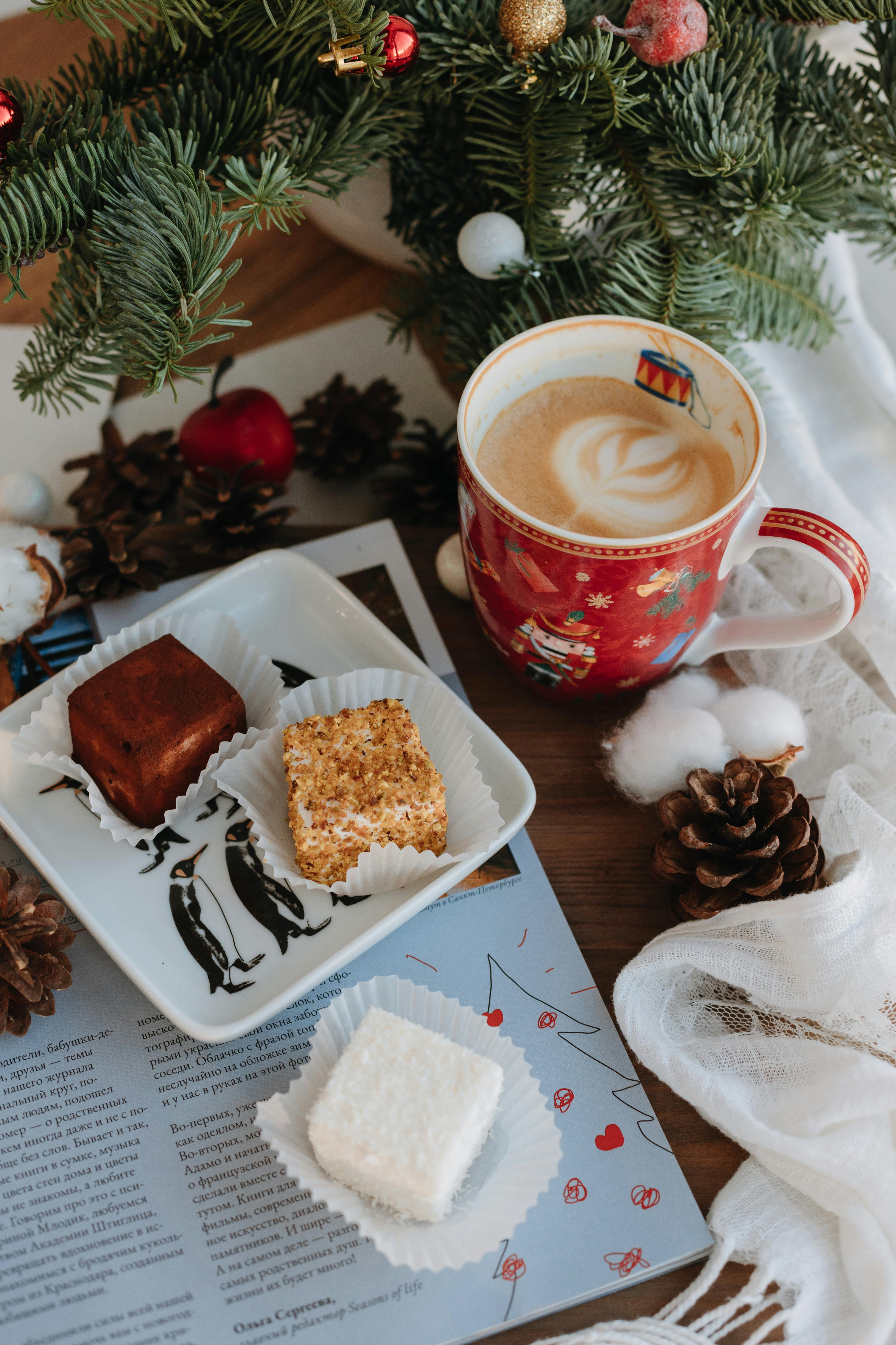 Cakes and Cappuccino by Christmas Pine Branches · Free Stock Photo