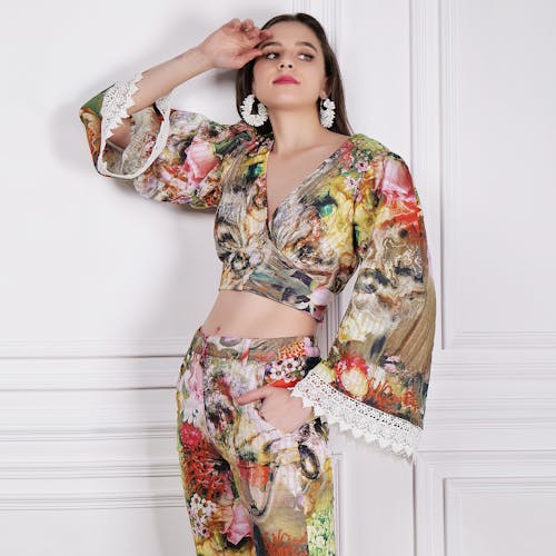 Young Woman in Floral Suit Posing in Studio